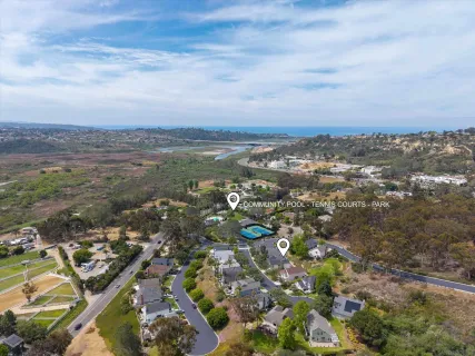 an aerial view of a house with a swimming pool