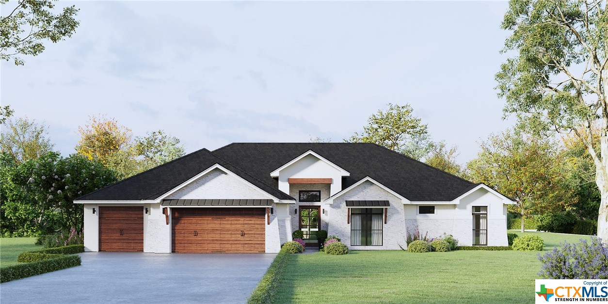 2018 Bluff Drive Nolanville, TX 76559 - Photo 1 of 1 a front view of a house with a garden