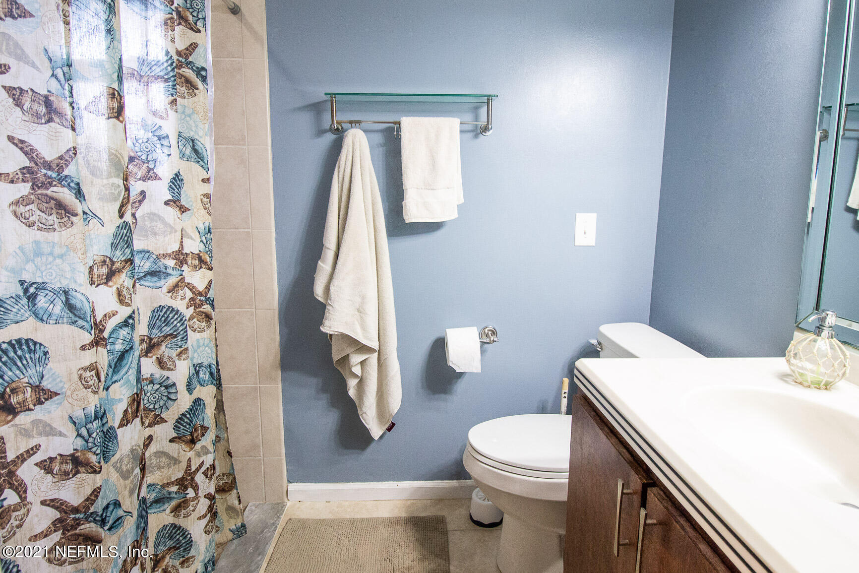 2159 Deer Run Trail Jacksonville, FL 32246 - Photo 12 of 15 a white toilet sitting next to a shower curtain