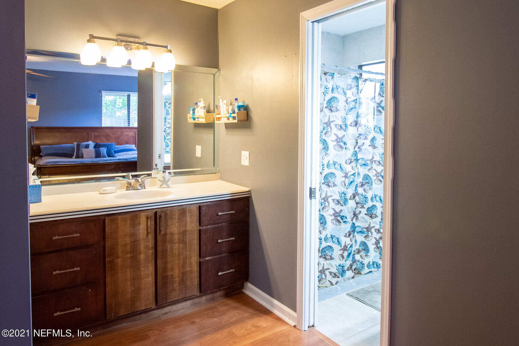 2159 Deer Run Trail Jacksonville, FL 32246 - Photo 13 of 15 a bathroom with a sink vanity and a mirror