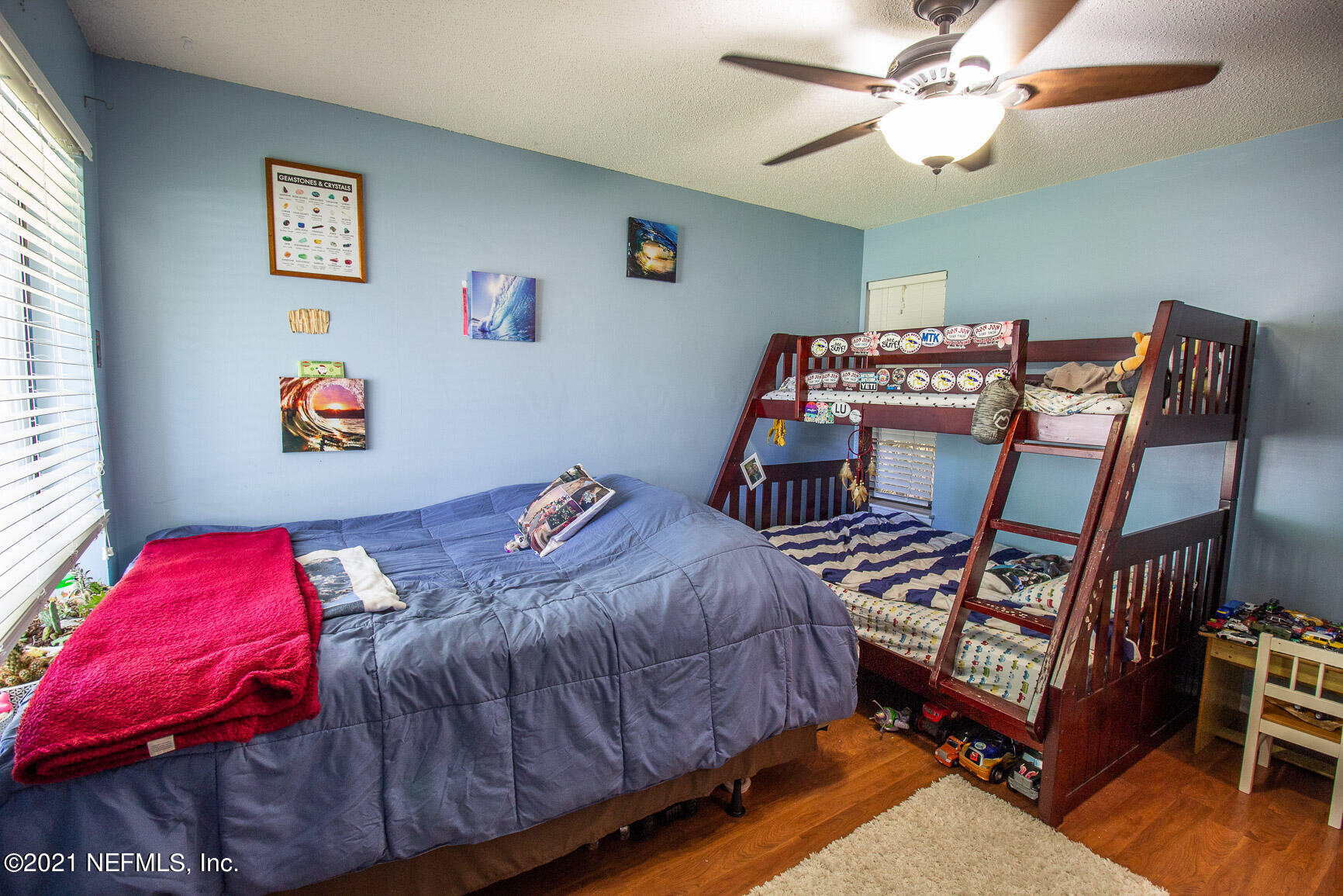 2159 Deer Run Trail Jacksonville, FL 32246 - Photo 14 of 15 a bedroom with a bed and a chandelier