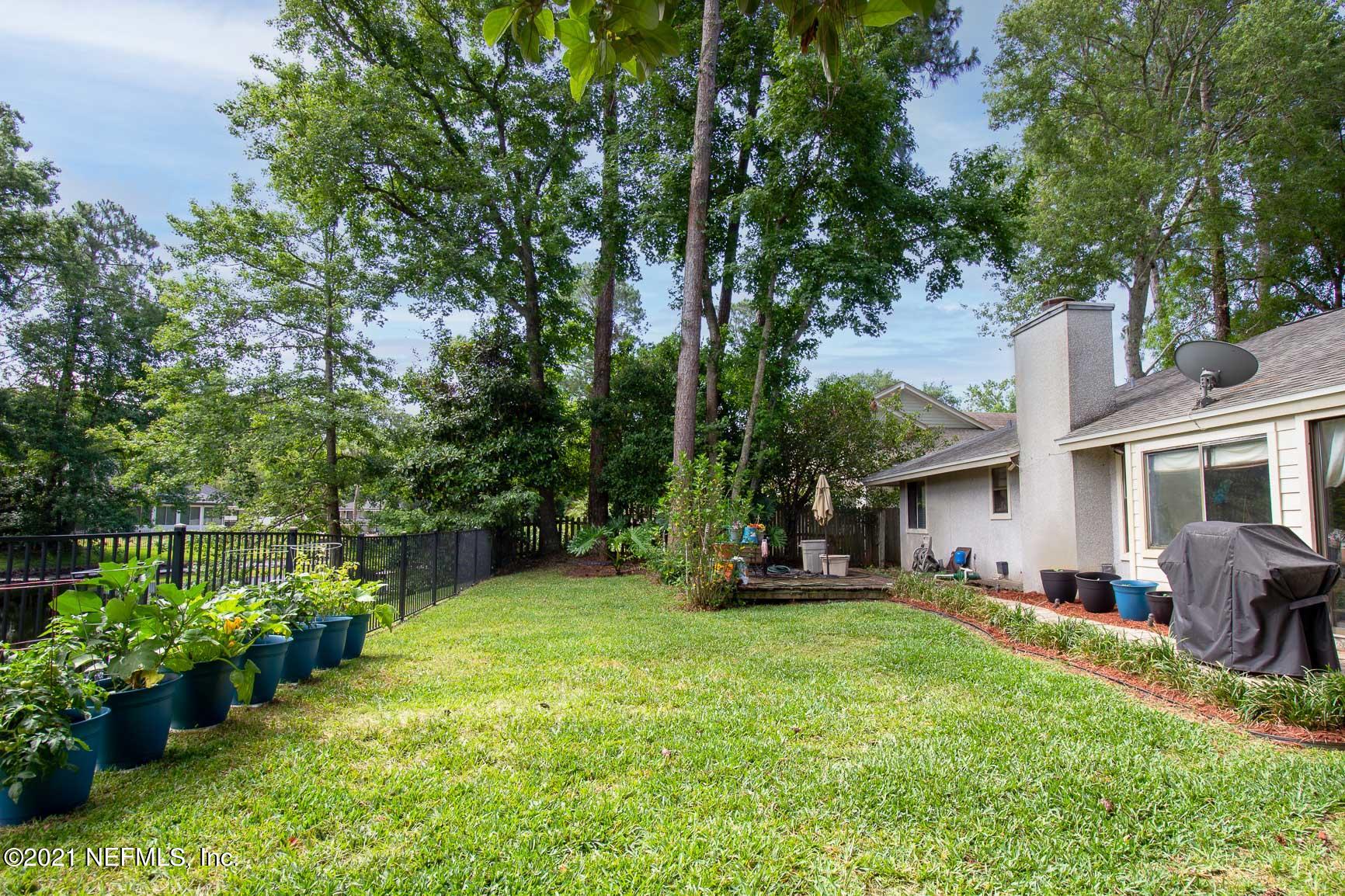 2159 Deer Run Trail Jacksonville, FL 32246 - Photo 2 of 15 a view of a house with backyard sitting area and garden