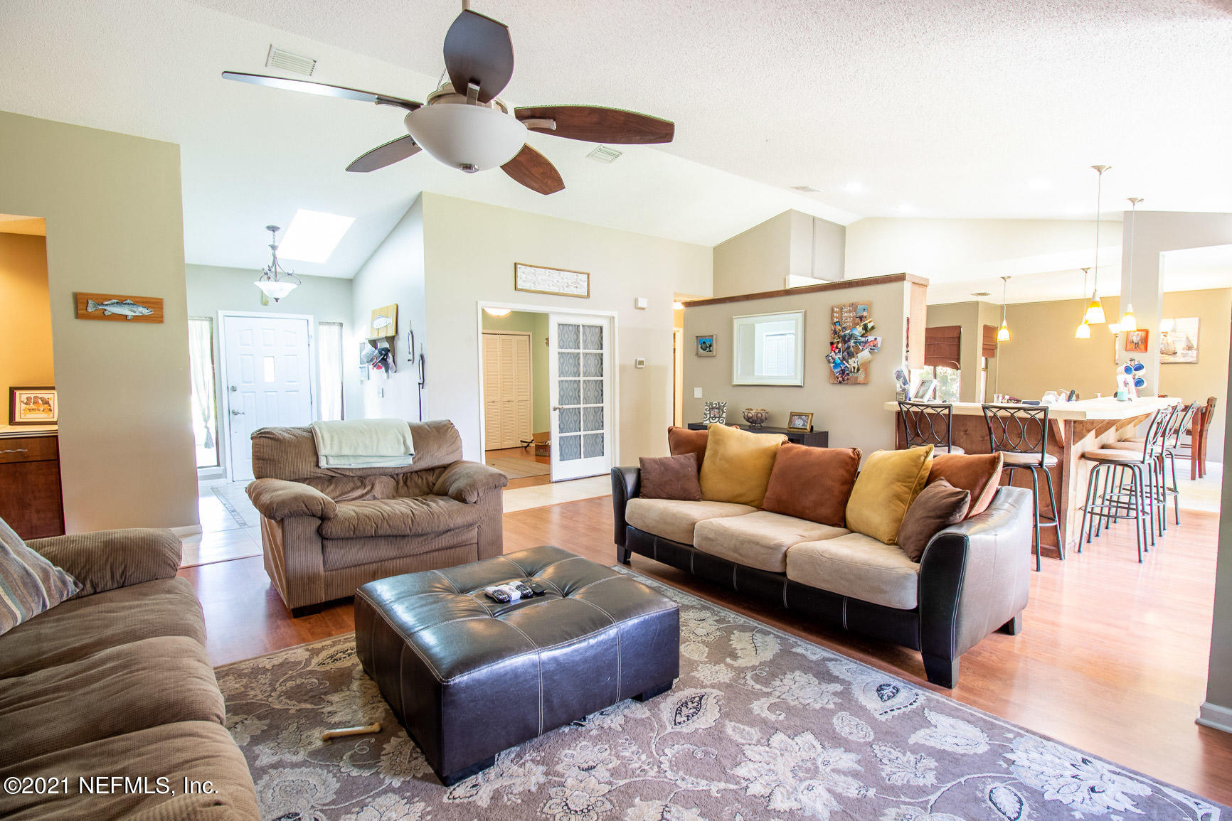 2159 Deer Run Trail Jacksonville, FL 32246 - Photo 8 of 15 a living room with furniture or couch and a chandelier