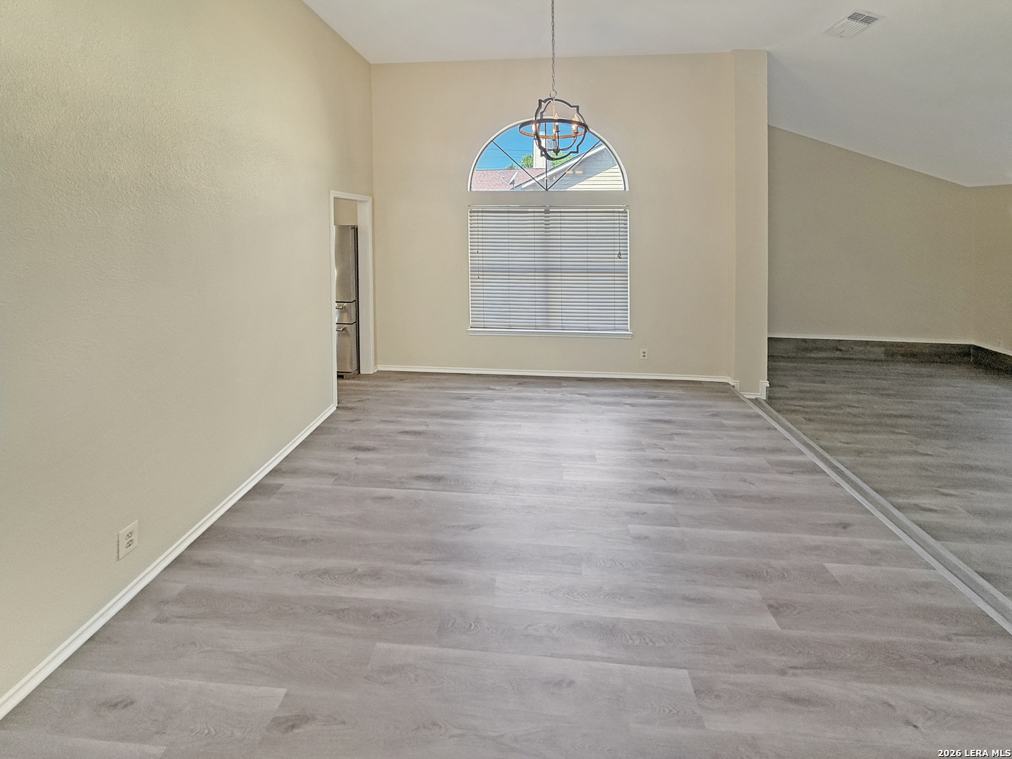 9808 Delta Ridge Drive Converse, TX 78109 - Photo 24 of 38 an empty room with wooden floor and windows