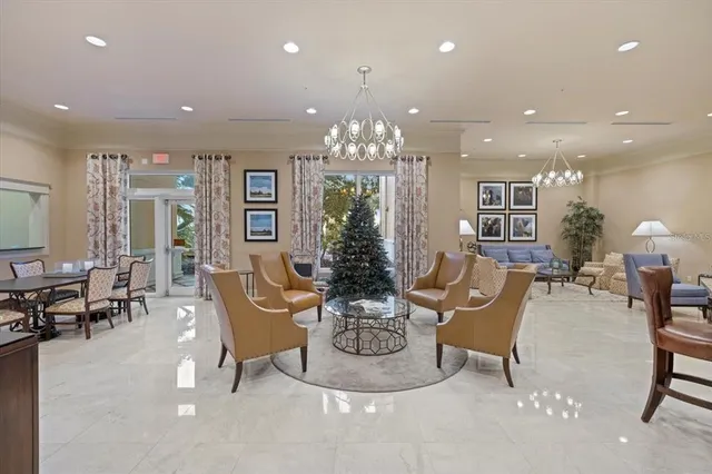 a living room with furniture and large window