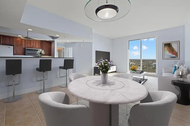 a kitchen with a dining table and chairs