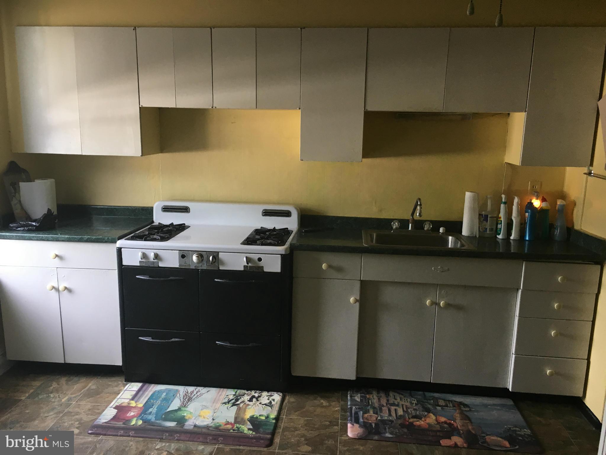 3615 Keswick Road Baltimore, MD 21211 - Photo 6 of 20 a kitchen with a sink and cabinets