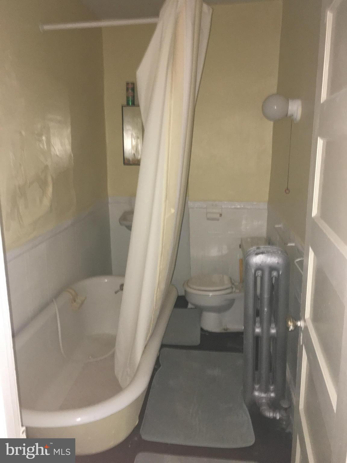 3615 Keswick Road Baltimore, MD 21211 - Photo 7 of 20 a bathroom with a sink and toilet