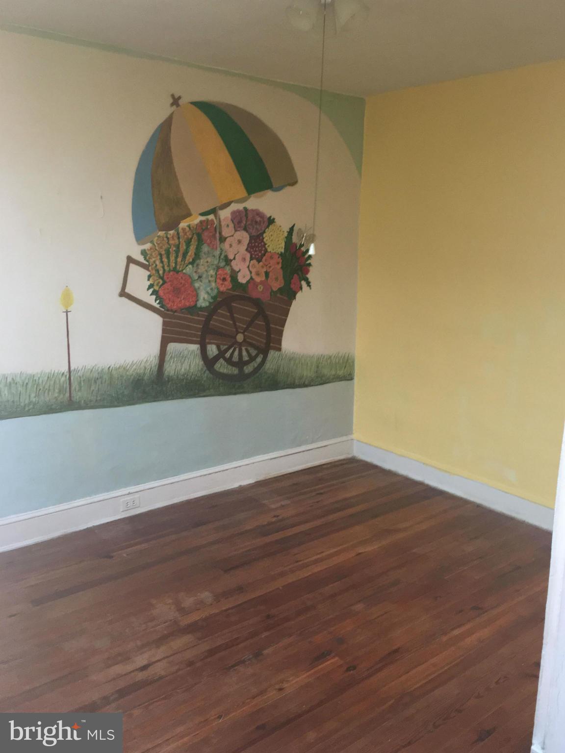 3615 Keswick Road Baltimore, MD 21211 - Photo 10 of 20 a view of a wooden floor in a room