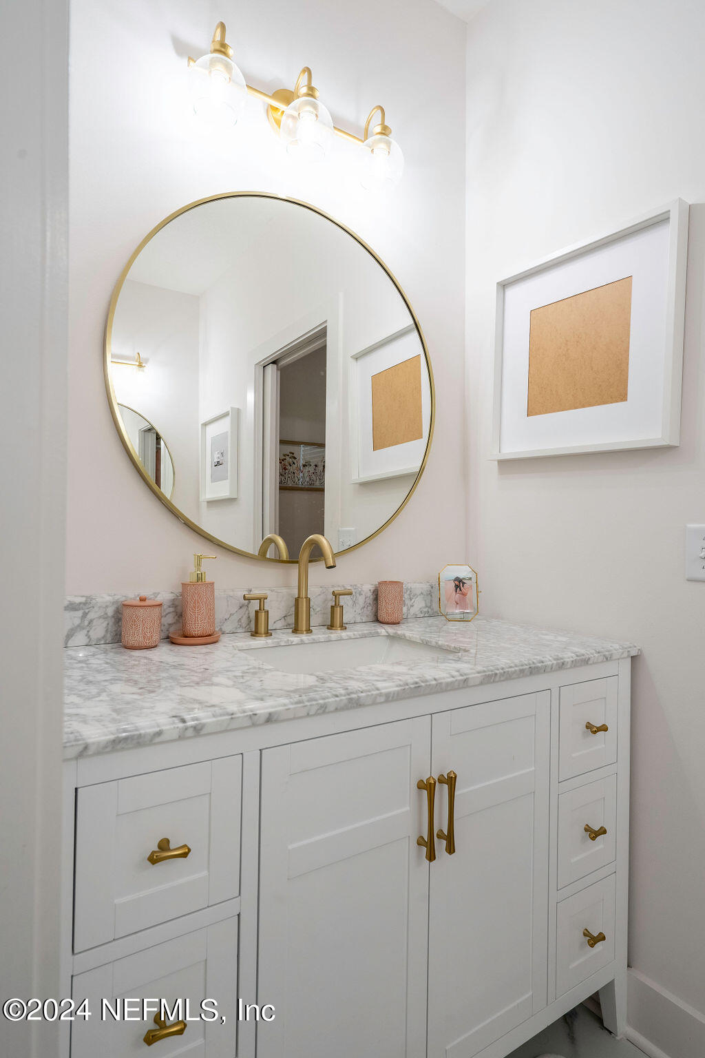 35364 Quail Road Callahan, FL 32011 - Photo 26 of 40 a bathroom with a granite countertop sink a mirror and vanity