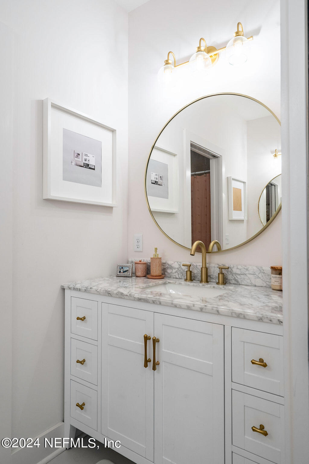 35364 Quail Road Callahan, FL 32011 - Photo 27 of 40 a bathroom with a granite countertop sink mirror and vanity