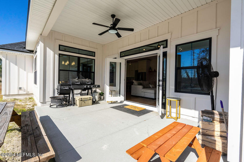 35364 Quail Road Callahan, FL 32011 - Photo 36 of 40 a room with patio furniture and a flat screen tv
