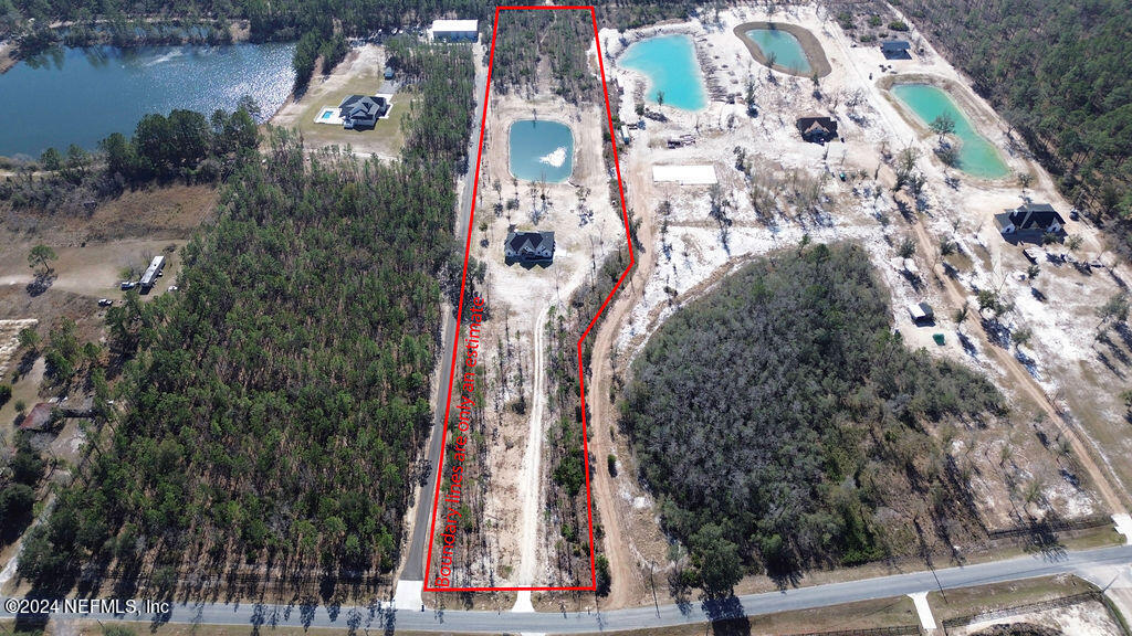 35364 Quail Road Callahan, FL 32011 - Photo 40 of 40 an aerial view of a residential apartment building with a yard