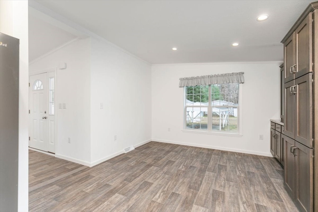 3 B Street Merrimac, MA 01860 - Photo 14 of 26 an empty room with wooden floor and a window
