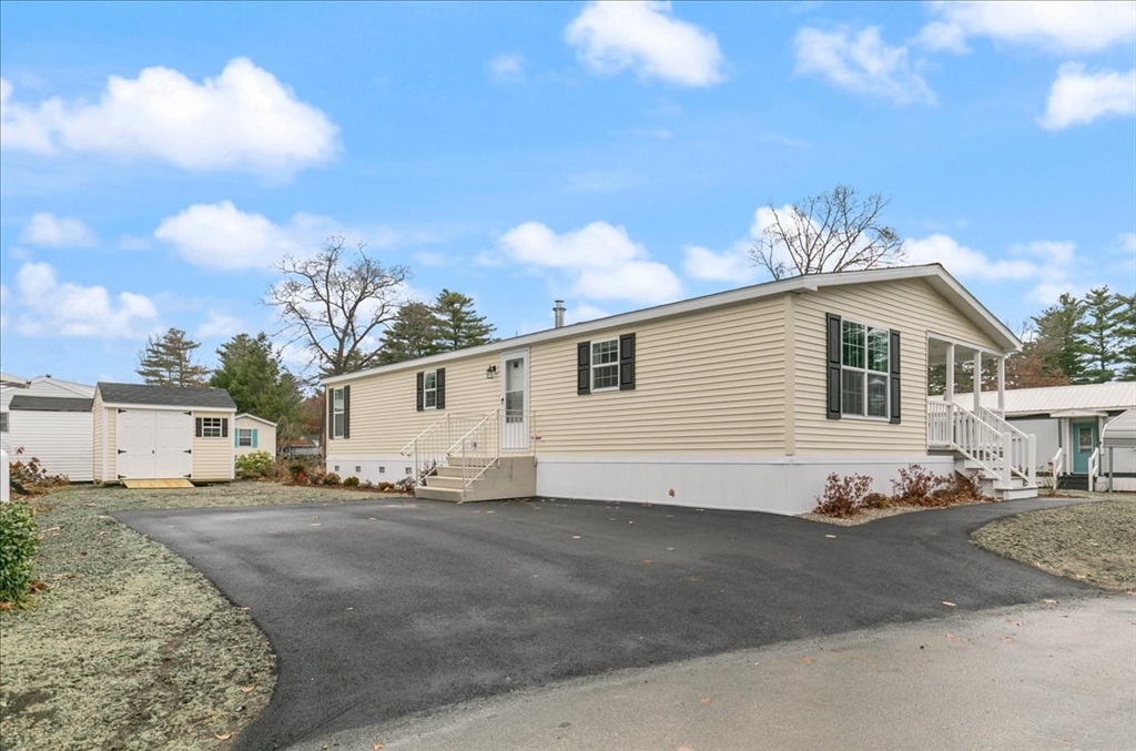 3 B Street Merrimac, MA 01860 - Photo 2 of 26 a view of a white house with a view of a big yard