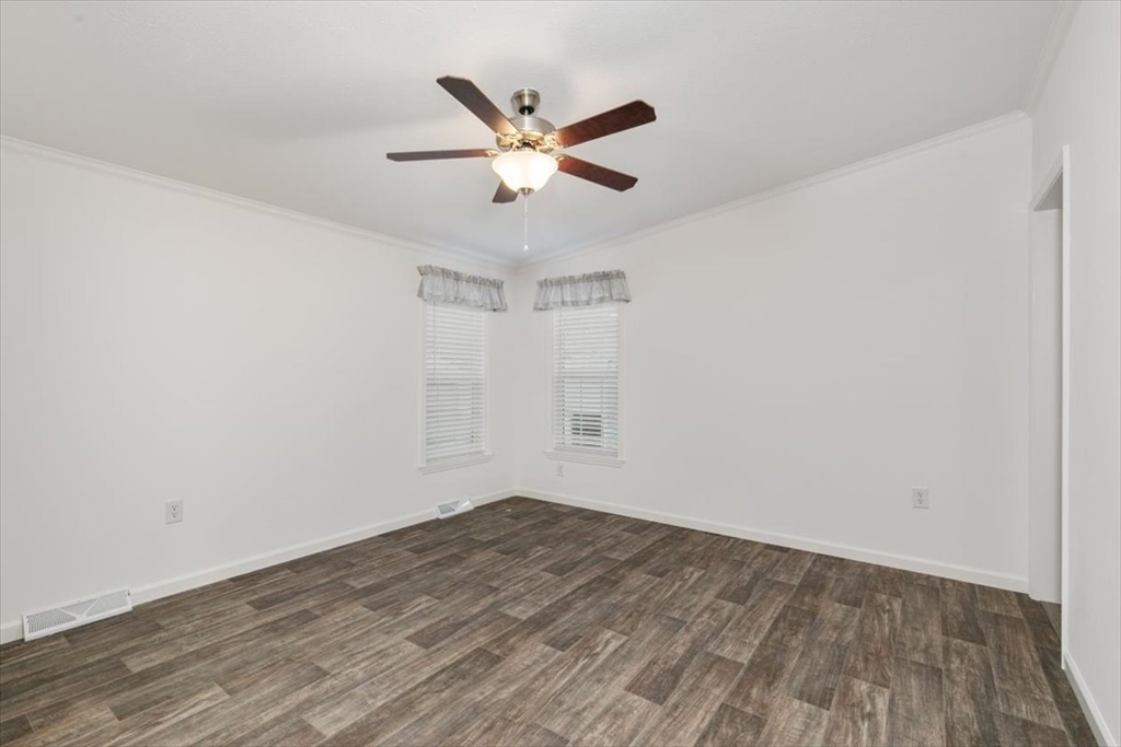 3 B Street Merrimac, MA 01860 - Photo 22 of 26 a view of a room with wooden floor and a ceiling fan
