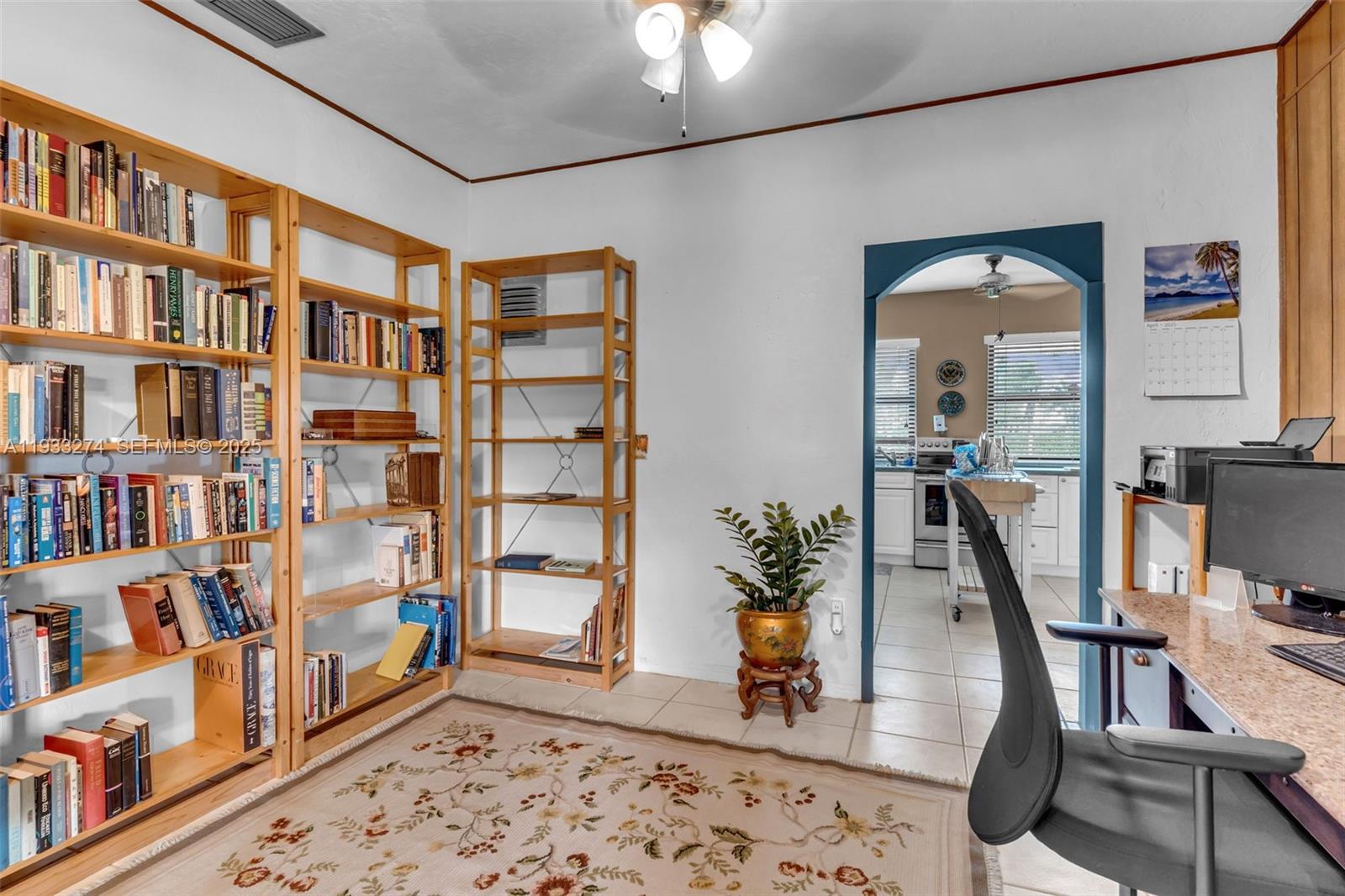18900 Southwest 224th Street Miami, FL 33170 - Photo 11 of 23 a living room with furniture and a book shelf