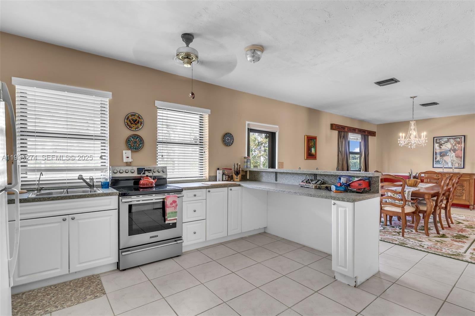 18900 Southwest 224th Street Miami, FL 33170 - Photo 13 of 23 a kitchen with lots of counter top space and sink
