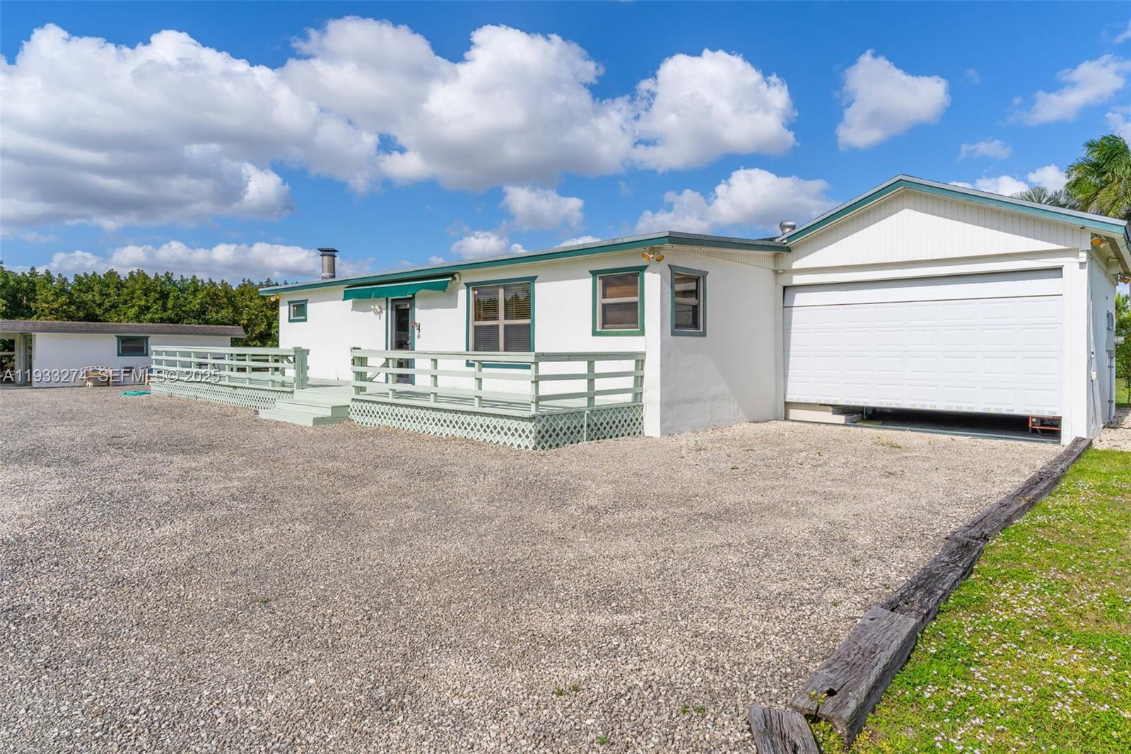 18900 Southwest 224th Street Miami, FL 33170 - Photo 3 of 23 a view of a house with entertaining space