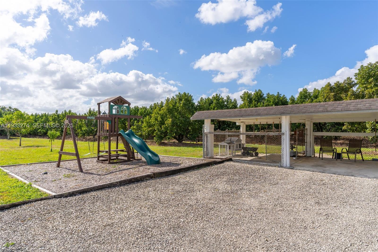 18900 Southwest 224th Street Miami, FL 33170 - Photo 4 of 23 a view of a house with swimming pool and porch with furniture