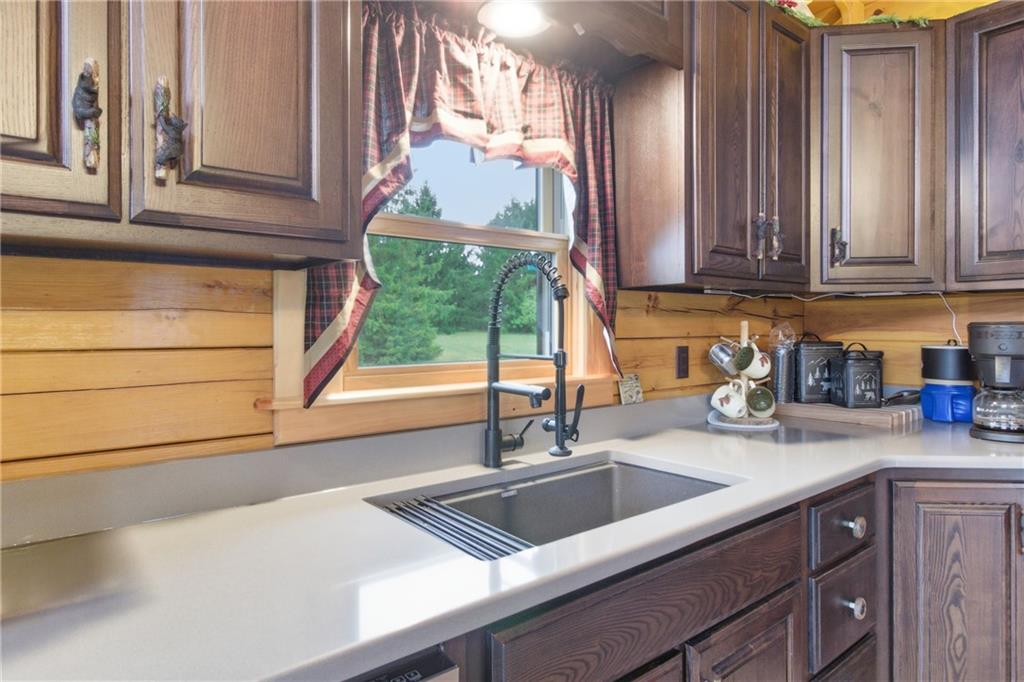 1089 Fire Tower Road Reynoldsville, PA 15851 - Photo 22 of 36 a kitchen with granite countertop a sink and a window