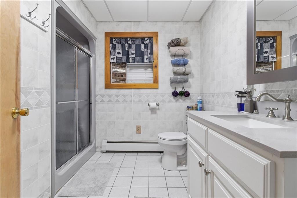 1089 Fire Tower Road Reynoldsville, PA 15851 - Photo 29 of 36 a bathroom with a sink a toilet and shower