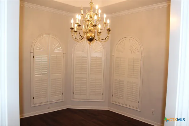 a view of a chandelier in hallway