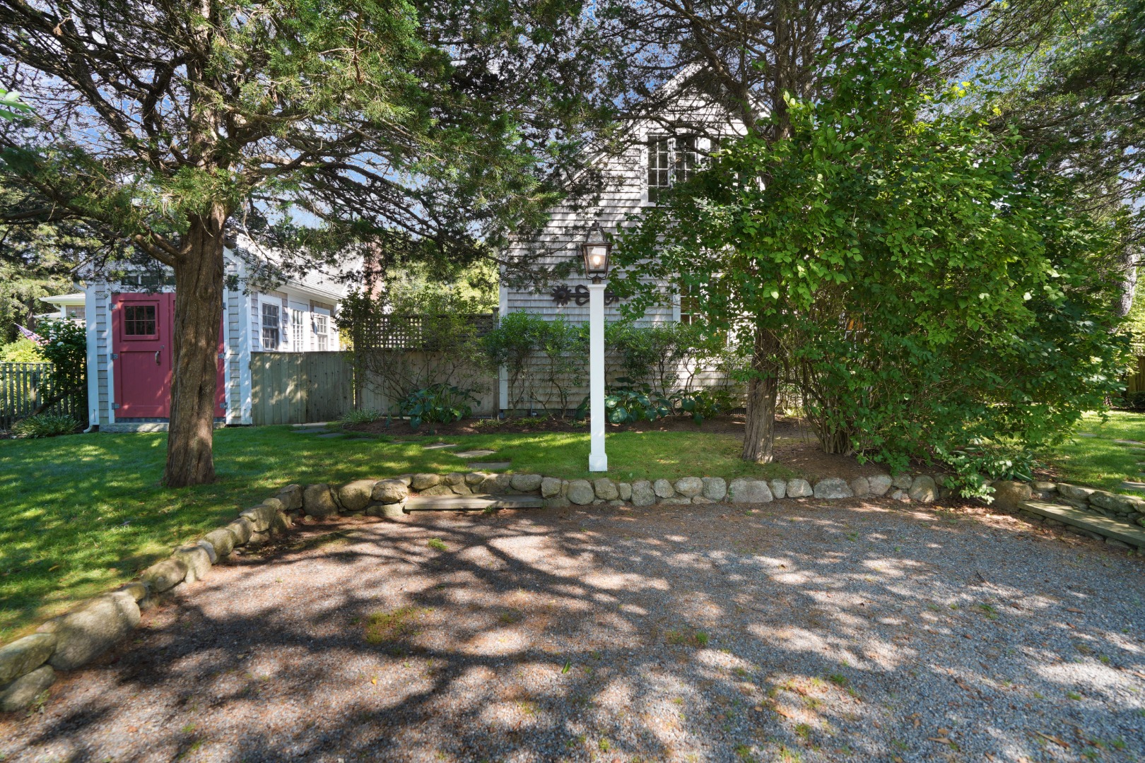 19 Kitts Field Circle Edgartown, MA 02539 - Photo 41 of 69 a view of a tree in the backyard of a house