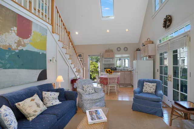 an aerial view of residential house with outdoor space and trees all around