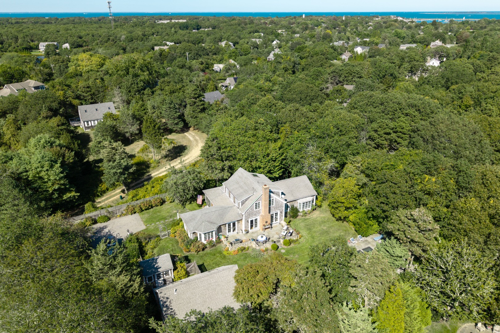 19 Kitts Field Circle Edgartown, MA 02539 - Photo 59 of 69 an aerial view of residential house with parking space and trees