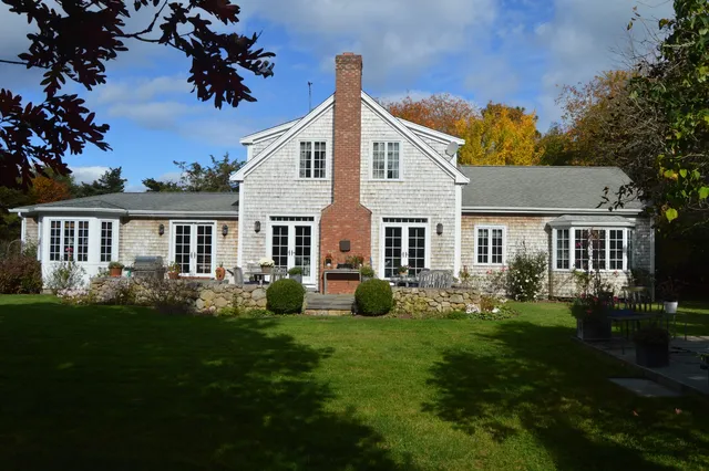 a view of a deck with couches and potted plants
