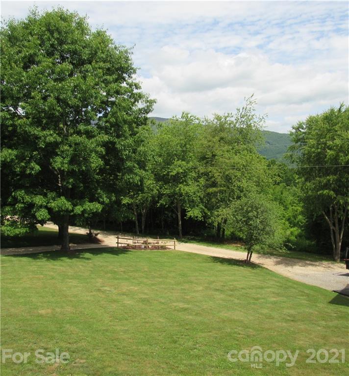 66 High Acres Road Waynesville, NC 28786 - Photo 2 of 41 a view of swimming pool with a yard
