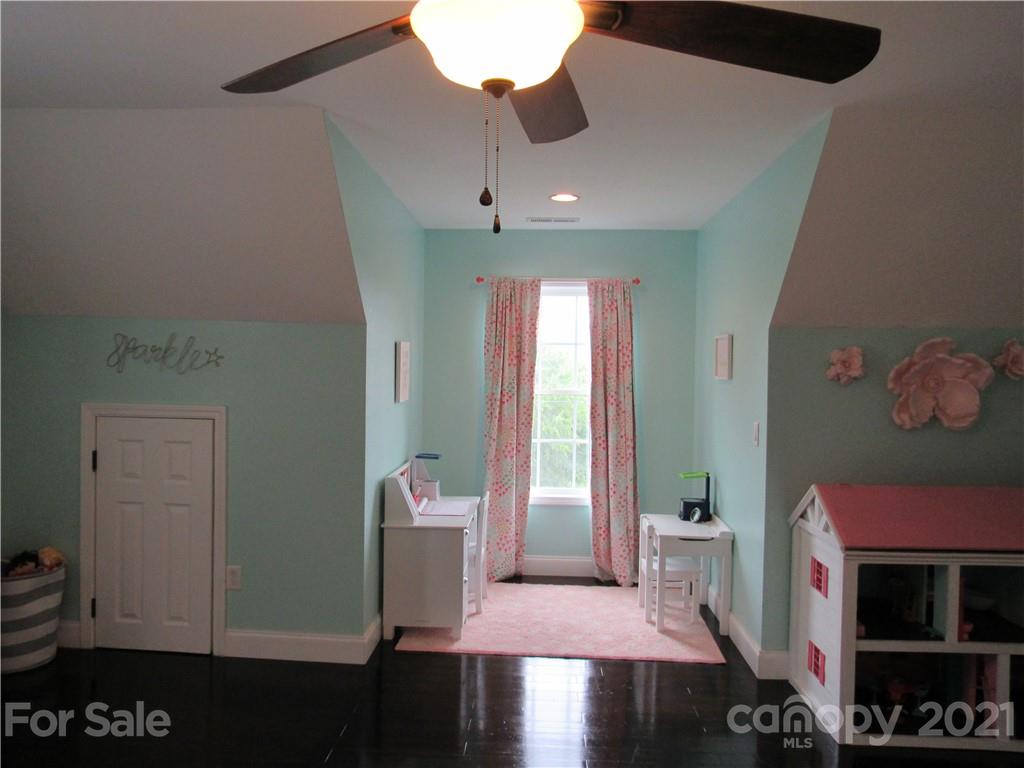 66 High Acres Road Waynesville, NC 28786 - Photo 20 of 41 a living room with furniture and a fireplace