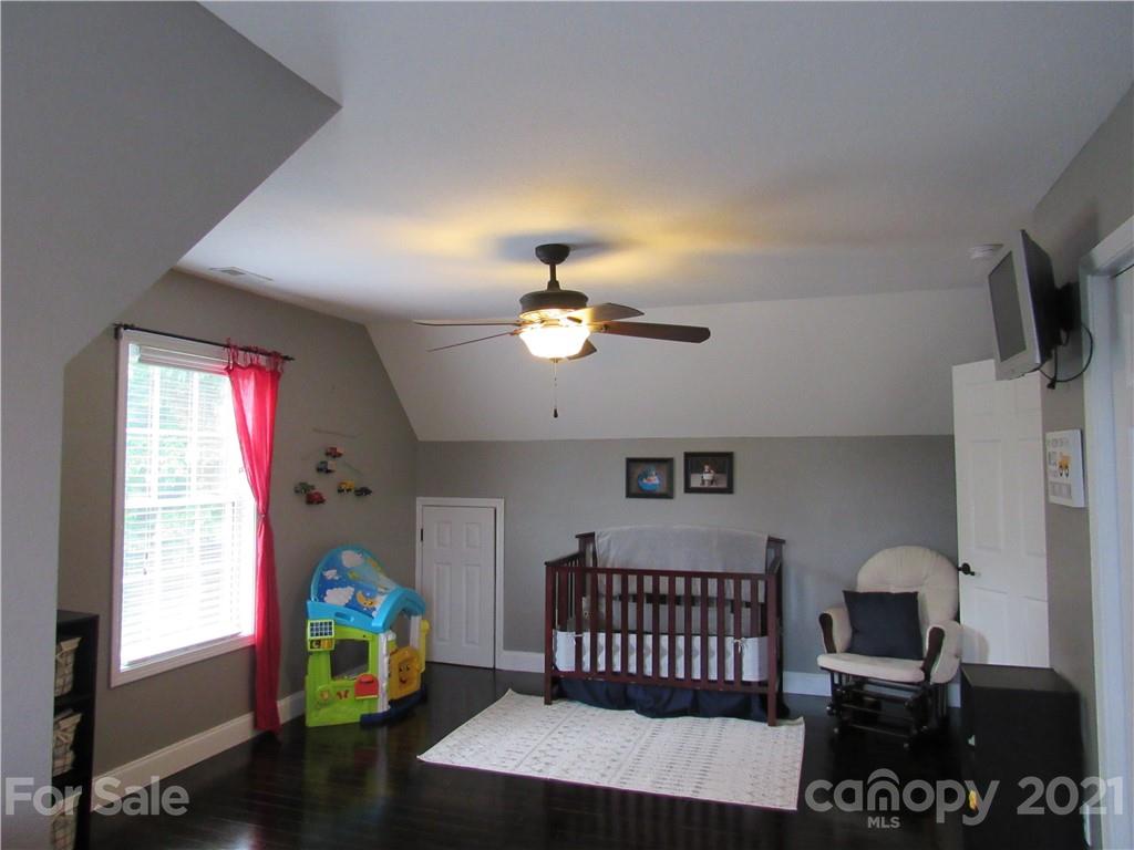 66 High Acres Road Waynesville, NC 28786 - Photo 27 of 41 a bedroom with bed and a window