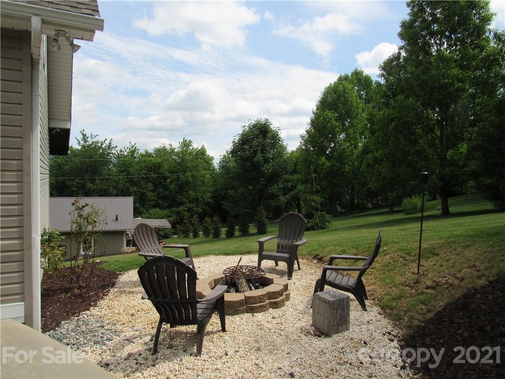 66 High Acres Road Waynesville, NC 28786 - Photo 30 of 41 a view of a sitting area with furniture and garden