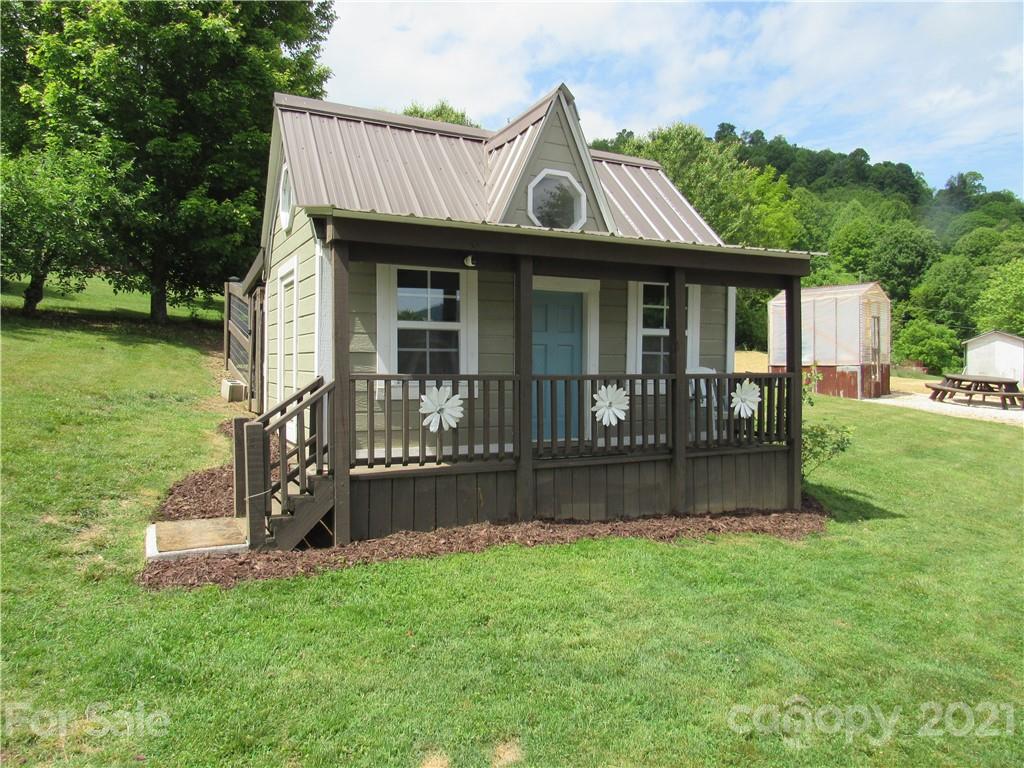 66 High Acres Road Waynesville, NC 28786 - Photo 33 of 41 a front view of a house with garden