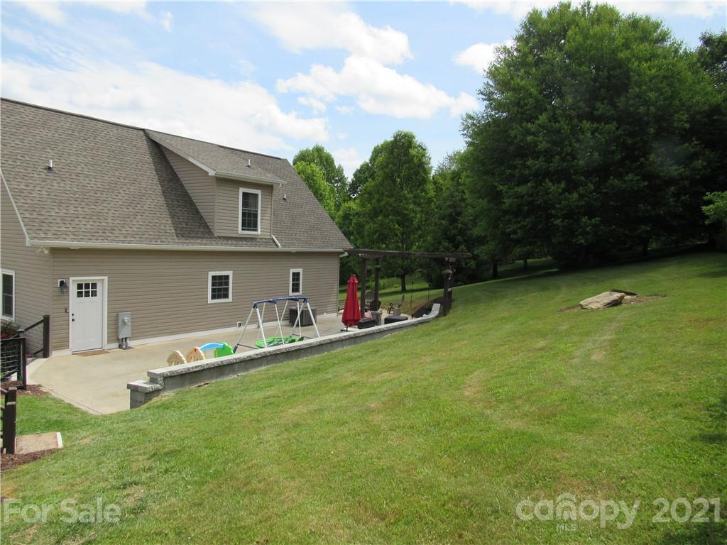 66 High Acres Road Waynesville, NC 28786 - Photo 35 of 41 a front view of house with yard and trees
