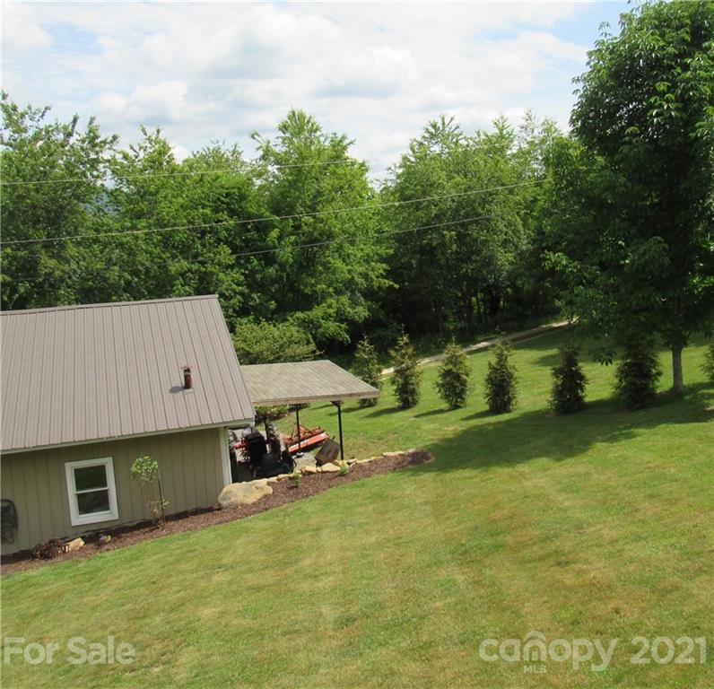 66 High Acres Road Waynesville, NC 28786 - Photo 38 of 41 an aerial view of a house having swimming pool