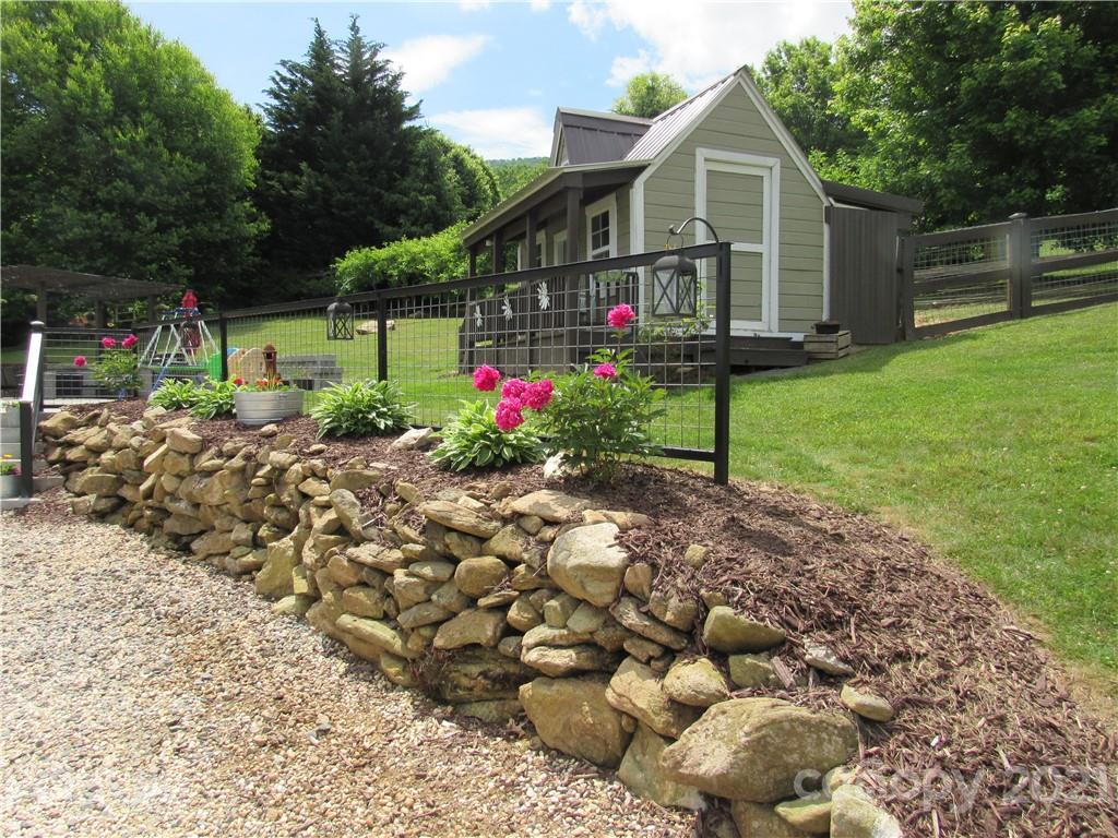 66 High Acres Road Waynesville, NC 28786 - Photo 39 of 41 a front view of a house with garden