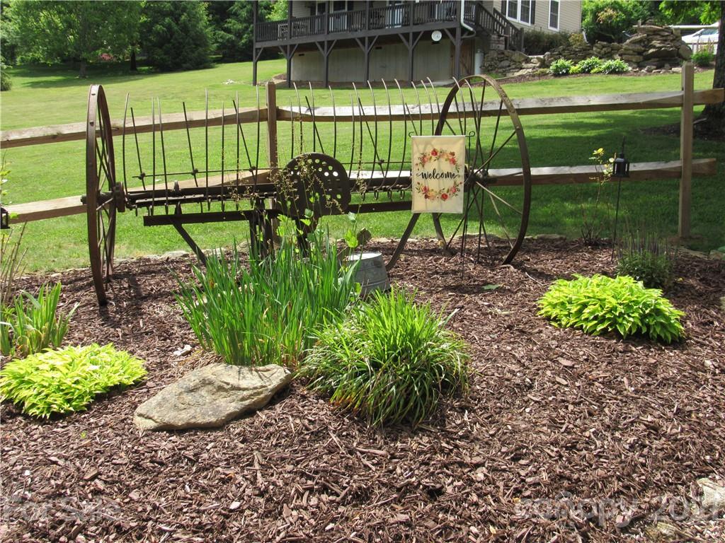 66 High Acres Road Waynesville, NC 28786 - Photo 40 of 41 a view of a park with a bench