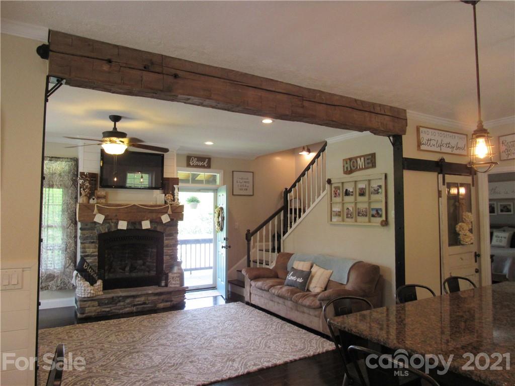 66 High Acres Road Waynesville, NC 28786 - Photo 5 of 41 a view of a dining room with furniture