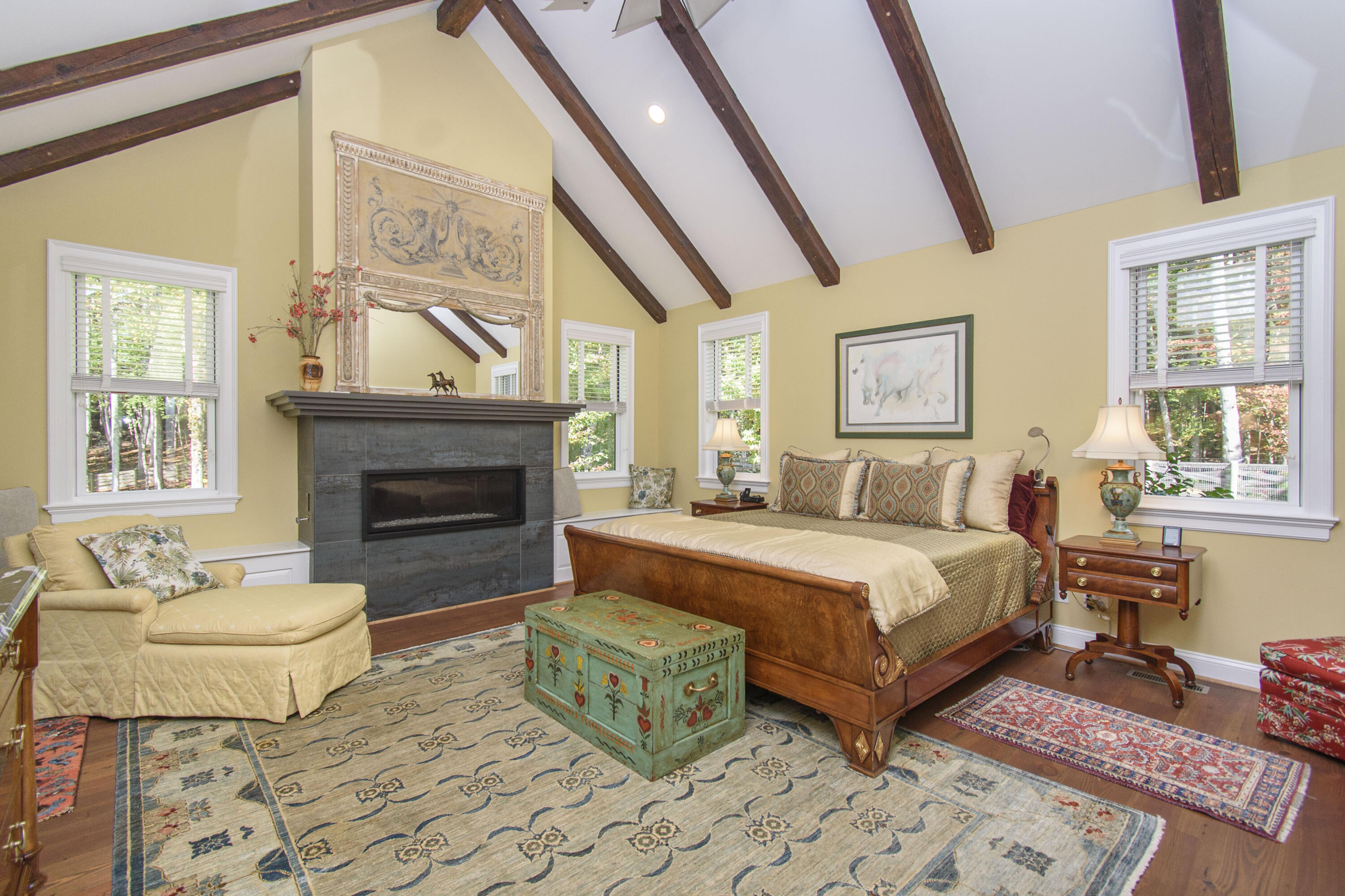 5600 Mt Tabor Road Blacksburg, VA 24060 - Photo 28 of 99 a spacious bedroom with a balcony a bed and a fireplace