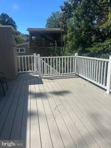 a view of deck with a yard