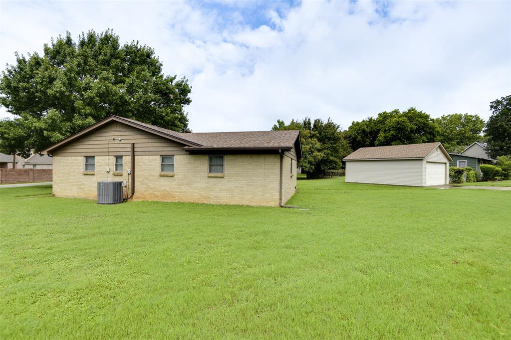 802 Cardinal Road Mansfield, TX 76063 - Photo 4 of 31 a view of an house with backyard space and garden