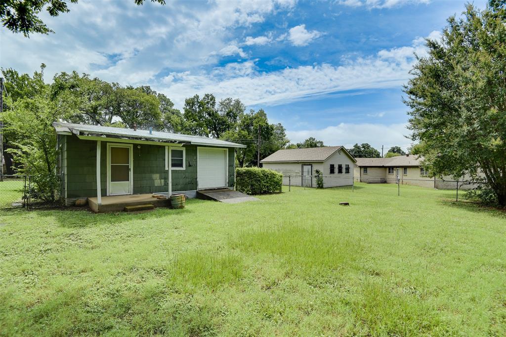 802 Cardinal Road Mansfield, TX 76063 - Photo 7 of 31 a view of a house with a back yard