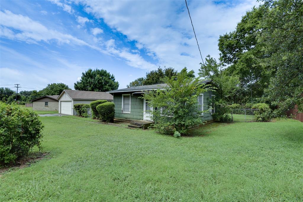 802 Cardinal Road Mansfield, TX 76063 - Photo 8 of 31 a view of a house with a backyard