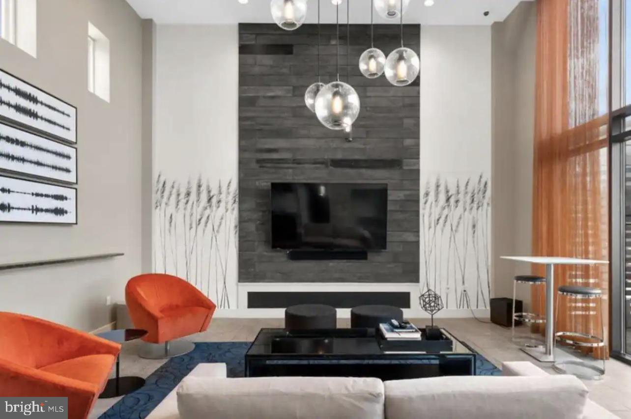 1320 Fenwick Lane, Unit 802 Silver Spring, MD 20910 - Photo 17 of 23 a living room with furniture and a fireplace