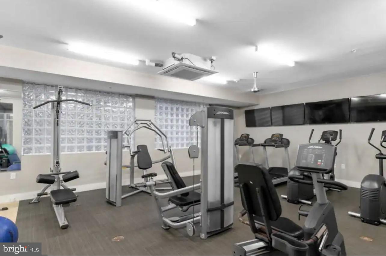 1320 Fenwick Lane, Unit 802 Silver Spring, MD 20910 - Photo 19 of 23 a view of a room with gym equipment