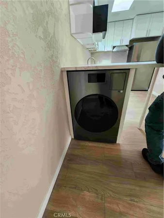 a kitchen with a sink and a microwave