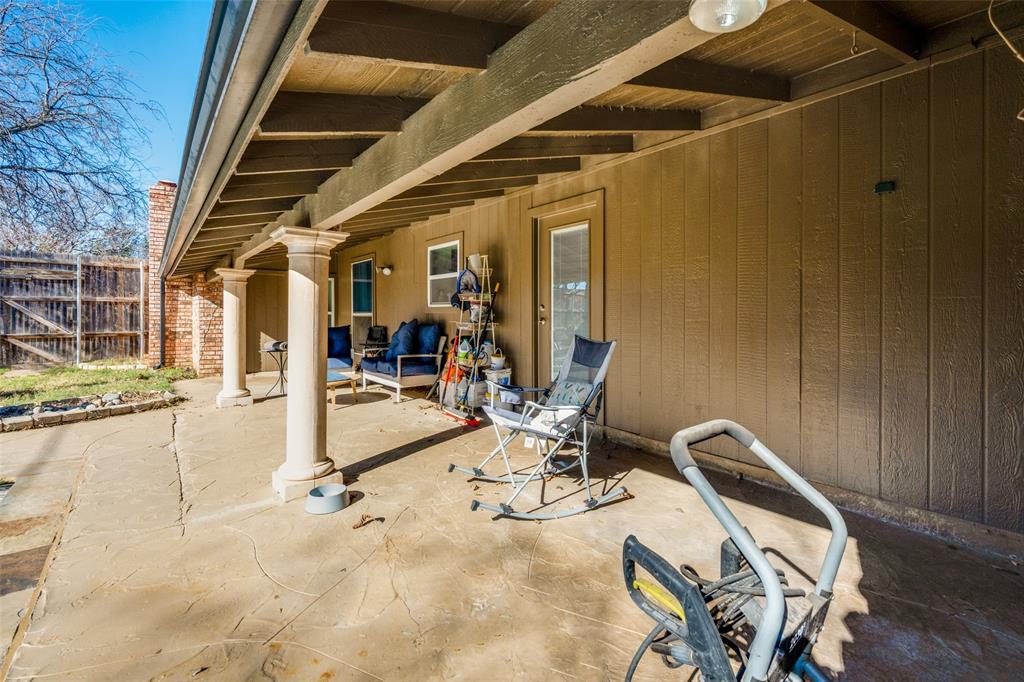 3108 Spring Valley Drive Bedford, TX 76021 - Photo 23 of 26 Covered patio on side of the house facing the pool and yard